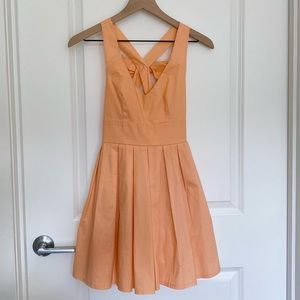 Xenia | V-Neck Fit and Flare Dress with Bow Detail
